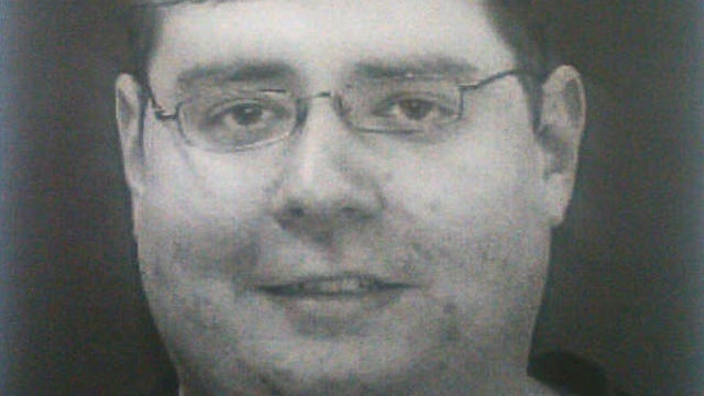 This image provided to CBS News by sources shows Neil Prescott, who was found in possession of 25 guns after allegedly making threats to carry out a workplace shooting.  