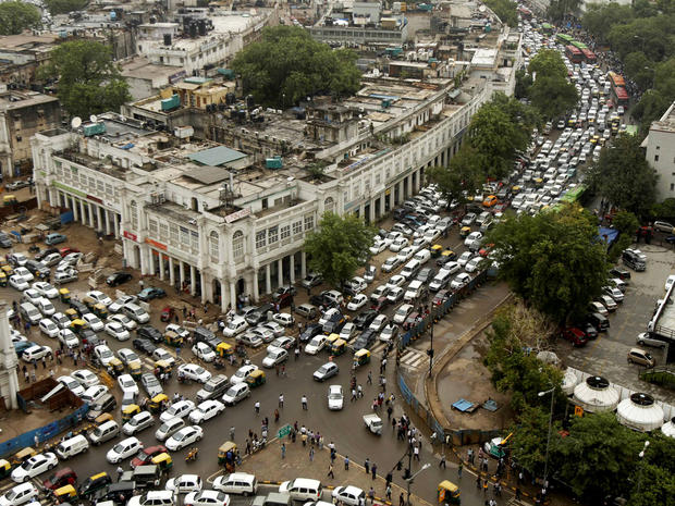 Streets are packed in heavy traffics following power outage and rains in the central part of New Delhi, India, Tuesday, July 31, 2012. 