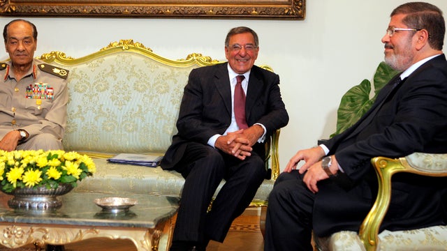 U.S. Defense Secretary Leon Panetta, center, meets with newly elected Egyptian President Mohammed Morsi, right, and the leader of Egypt's military, Field Marshal Mohammed Hussein Tantawi, in Cairo July 31, 2012. 