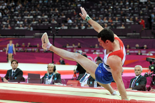 149634946-harry-how-kristian-thomas-of-great-britain-falls-during-his-landing-from-the-vault-in-the-artistic-gymnastics-mens-individual-all-around-final.jpg 