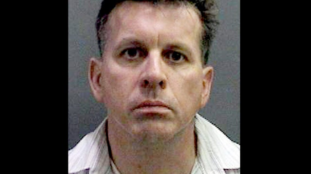 Rainer Reinscheid, 48, a professor at the University of California, Irvine, is pictured in a booking photo. 