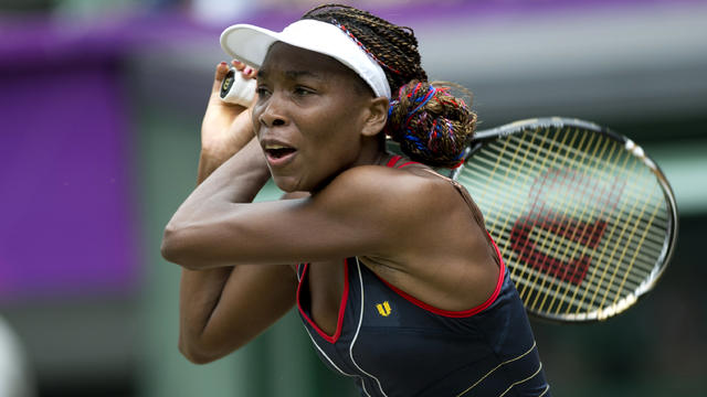 Venus Williams returns the ball to Canada's Aleksandra Wozniak during their London 2012 Olympic Games tennis match  on July 31, 2012. 