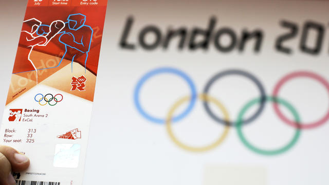 A fan holds up a ticket while waiting for a preliminary boxing bout to start at the Summer Olympics July 28, 2012, in London. 