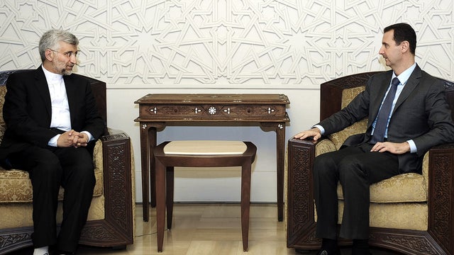 Syrian President Bashar Assad meets with senior Iranian envoy Saeed Jalili in Damascus, Syria, Aug. 7, 2012, in this photo released by the Syrian state-run news agency SANA. 