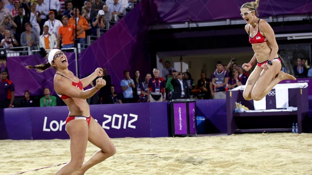 Misty May-Treanor, left, and Kerri Walsh Jennings celebrate win over April Ross and Jennifer Kessy in women's gold medal beach volleyball match Wednesday 