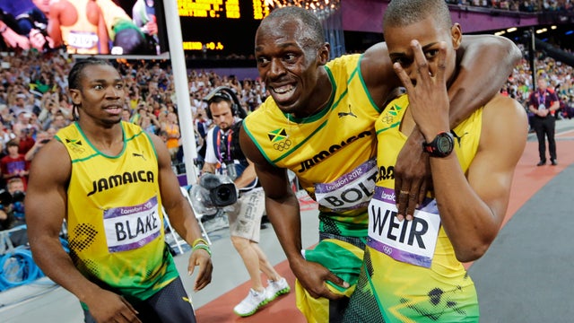 Jamaica's Usain Bolt, center, Jamaica's Yohan Blake, left, and Jamaica's Warren Weir celebrate their medals 