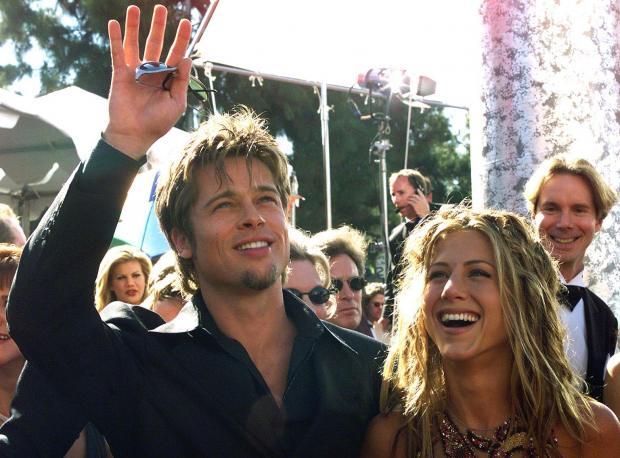 actor-brad-pitt-l-waves-to-spectators-as-he-arrives-with-his-girlfriend-actress-jennifer-aniston-hector-mata.jpg 