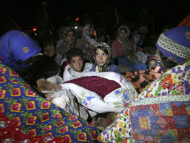Residents spend the night outside their homes after an earthquake in the city of Varzaqan 
