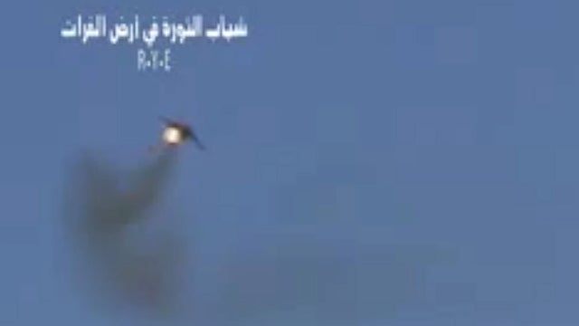 This image made from amateur video released by the R.Y.E. Syria and accessed Monday Aug. 13, 2012, purports to show a Syrian plane downed over the eastern province of Deir el-Zour, Syria, Monday Aug. 13, 2012. 