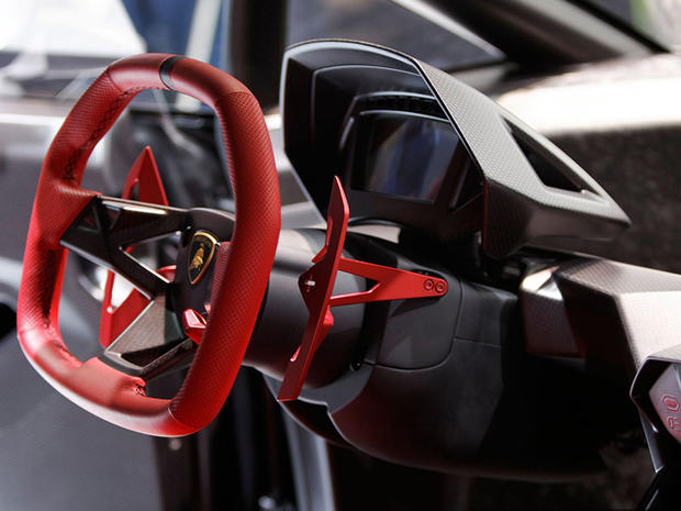 This image shows the dashboard cluster and steering wheel of the Lamborghini Sesto Elemento concept car 