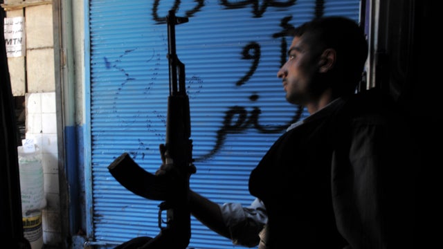 A Syrian rebel sits in a van in Aleppo 