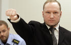 Mass murderer Anders Behring Breivik makes salute after he arrives at court in Oslo Friday Aug. 24, 2012 . Breivik has been declared sane and sentenced to prison for bomb and gun attacks that killed 77 people last year. 