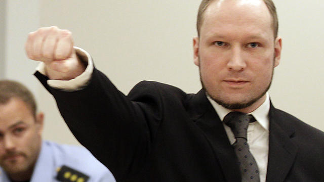 Mass murderer Anders Behring Breivik makes salute after he arrives at court in Oslo Friday Aug. 24, 2012 . Breivik has been declared sane and sentenced to prison for bomb and gun attacks that killed 77 people last year. 