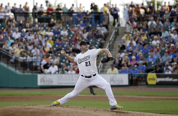 Roger Clemens throws a pitch during a baseball game 