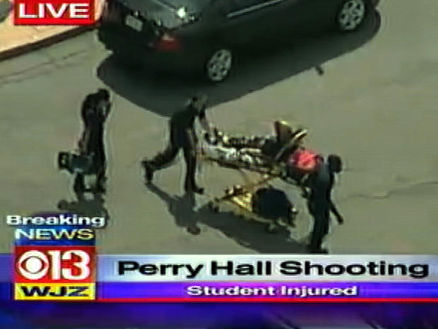 A patient is seen on a stretcher after a shooting at Perry Hall High School in Perry Hall, Md., Aug. 27, 2012. 