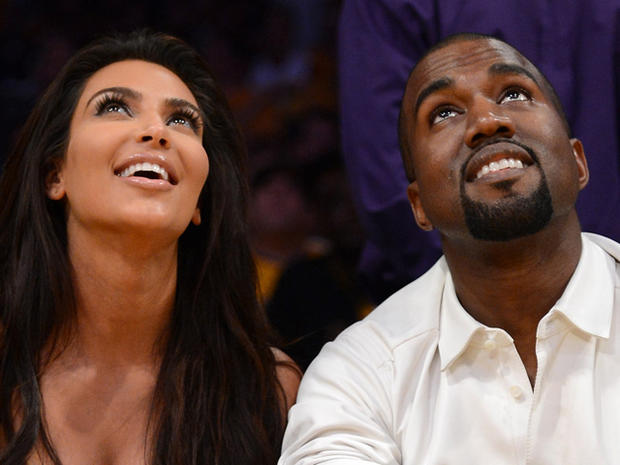 Kim Kardashian and Kanye West watch the video board from their courtside seats at Staples Center on May 12 as the Los Angeles Lakers host the Denver Nuggets in Game Seven of the Western Conference Quarterfinals in the 2012 NBA Playoffs 