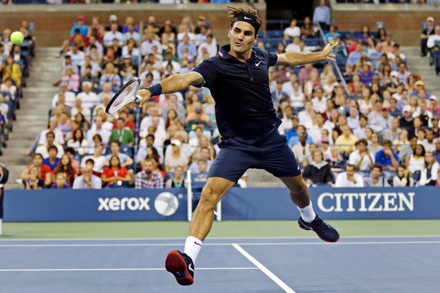 Roger Federer returns against Donald Young 