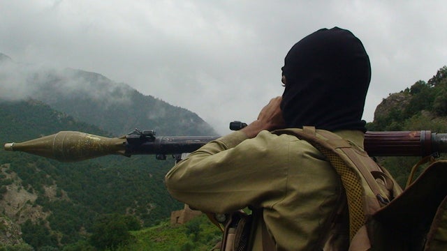 Pakistani Taliban militant holds a rocket-propelled grenade 