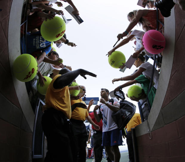 France's Jo-Wilfried Tsonga signs autographs 