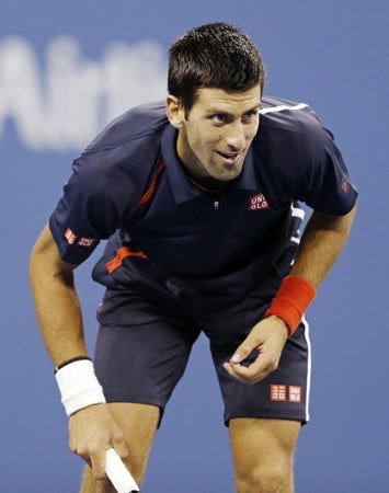 Novak Djokovic eyes a return shot  