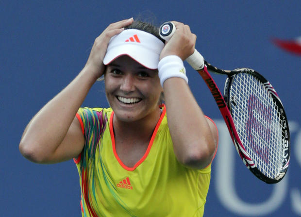 Laura Robson of Great Britain reacts after beating Kim Clijsters 