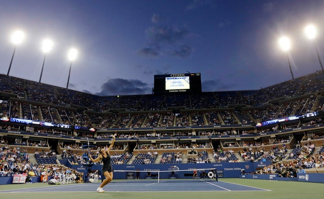 Maria Sharapova, of Russia, serves to Lourdes Dominguez Lino,  