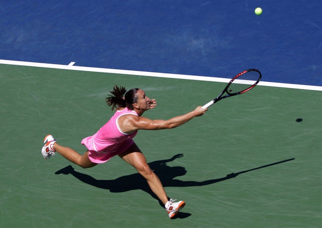 Jelena Jankovic returns a shot  