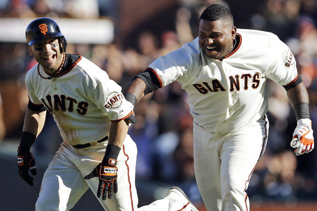 Marco Scutaro is chased by Pablo Sandoval 