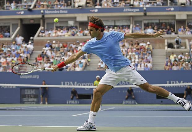 Roger Federer returns a shot  