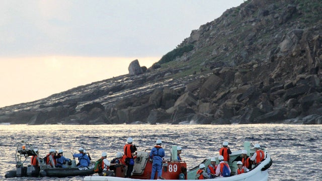 A team of Japanese surveyors conducts survey from boats 
