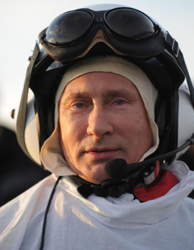 Russian President Vladimir Putin prepares for a flight in a motorized hang glider 