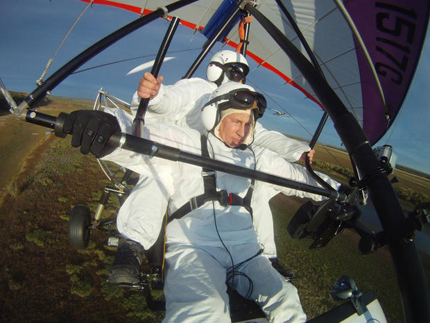 Russian President Vladimir Putin, flies in a motorized hang glider 