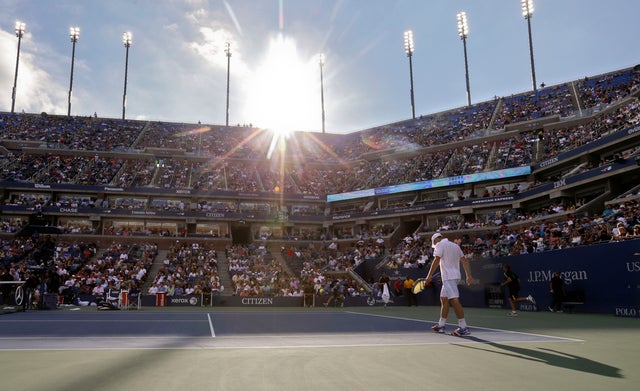 Andy Roddick walks onto the court during his match with Juan Martin Del Potro  