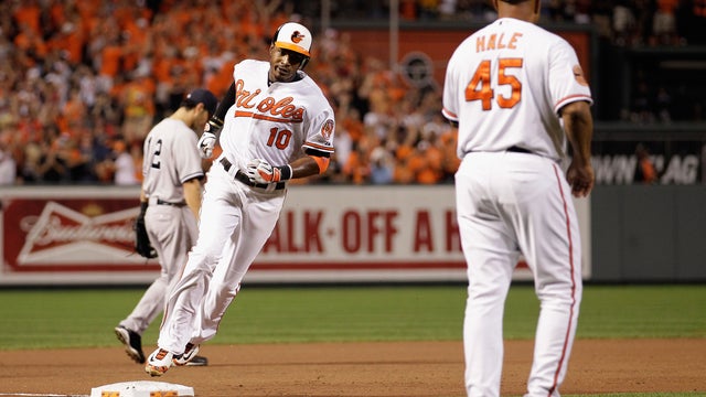 Adam Jones rounds the bases after hitting a solo home run 