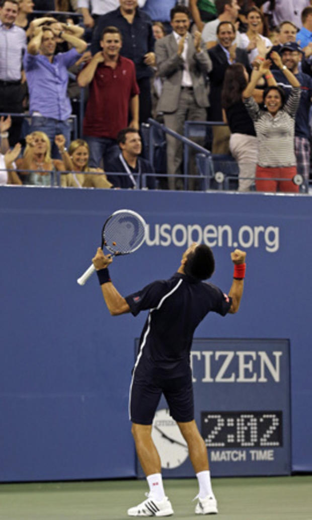 Novak Djokovic, of Serbia, cheers with the crowd  