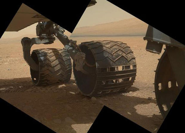 This view of the three left wheels of NASA's Mars rover Curiosity combines two images that were taken by the rover's Mars Hand Lens Imager (MAHLI) during the 34th Martian day, or sol, of Curiosity's work on Mars (Sept. 9, 2012). 