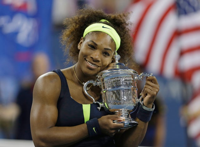 Serena Williams holds the championship trophy after beating Victoria Azarenka 