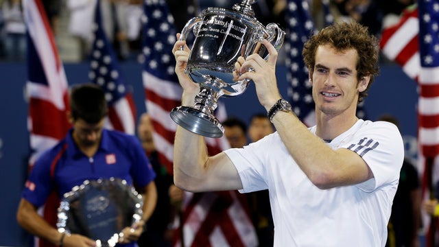 Andy Murray poses with the trophy 