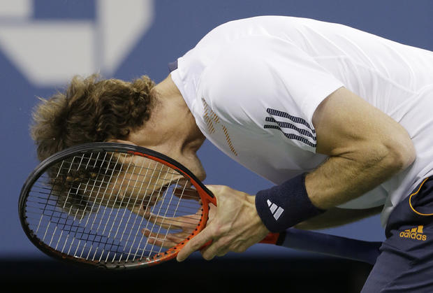 Andy Murray reacts while playing against Novak Djokovic  