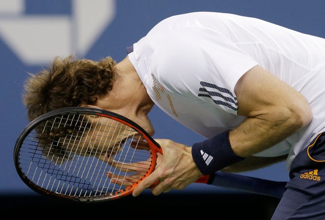 Andy Murray reacts while playing against Novak Djokovic  