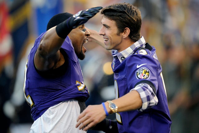 Ray Lewis and Michael Phelps hug 