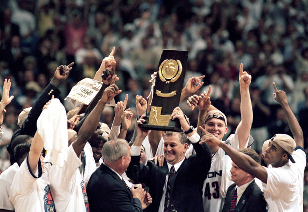 Jim Calhoun holds up the trophy after the NCAA Championship 