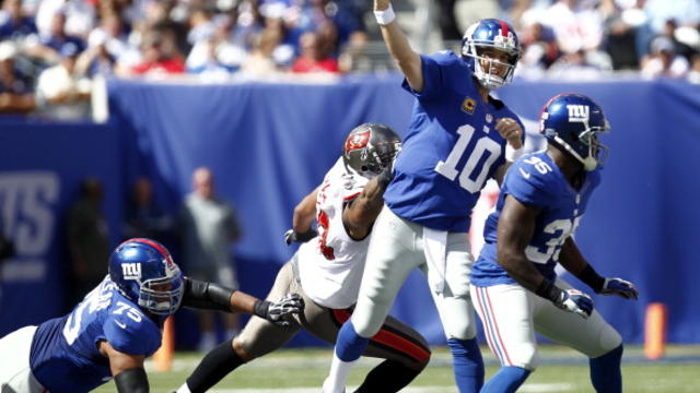 NFL ROUNDUP: Eli Manning lifts Giants to wild win over Bucs