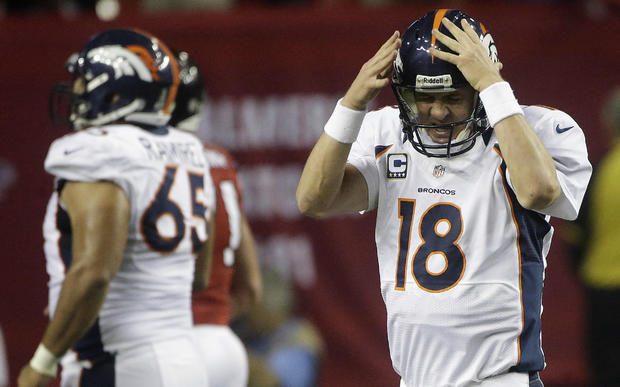 Peyton Manning reacts after being sacked  