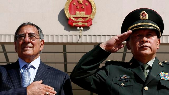U.S. Defense Secretary Leon Panetta, left, stands at attention during the national anthem next to China's Defense Minister Liang Guanglie 