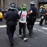 Occupy Wall Street protestor is arrested on Wall Street for blocking pedestrian traffic Monday 