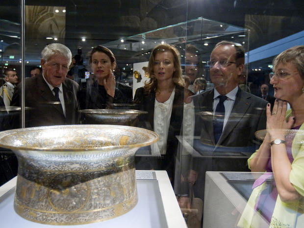 French President Francois Hollande looks at the Saint Louis baptistery 