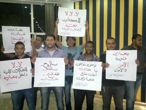 "Save Benghazi" protesters show off placards 