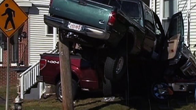 Truck crashes into Mass. home 