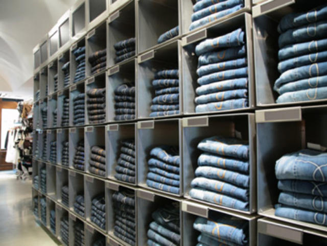 Jeans of Different Styles on the Hanger in the Showroom. Stock Image -  Image of clothes, denim: 104685137